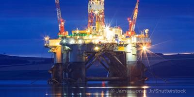 Close up of large blue merchant crago ship in the middle of the ocean underway. Performing cargo export and import operations with sun rays, horizon line and beautiful sky.; Shutterstock ID 1468222610; purchase_order: Graphics; job: ; client: Chris Reeves; other: 