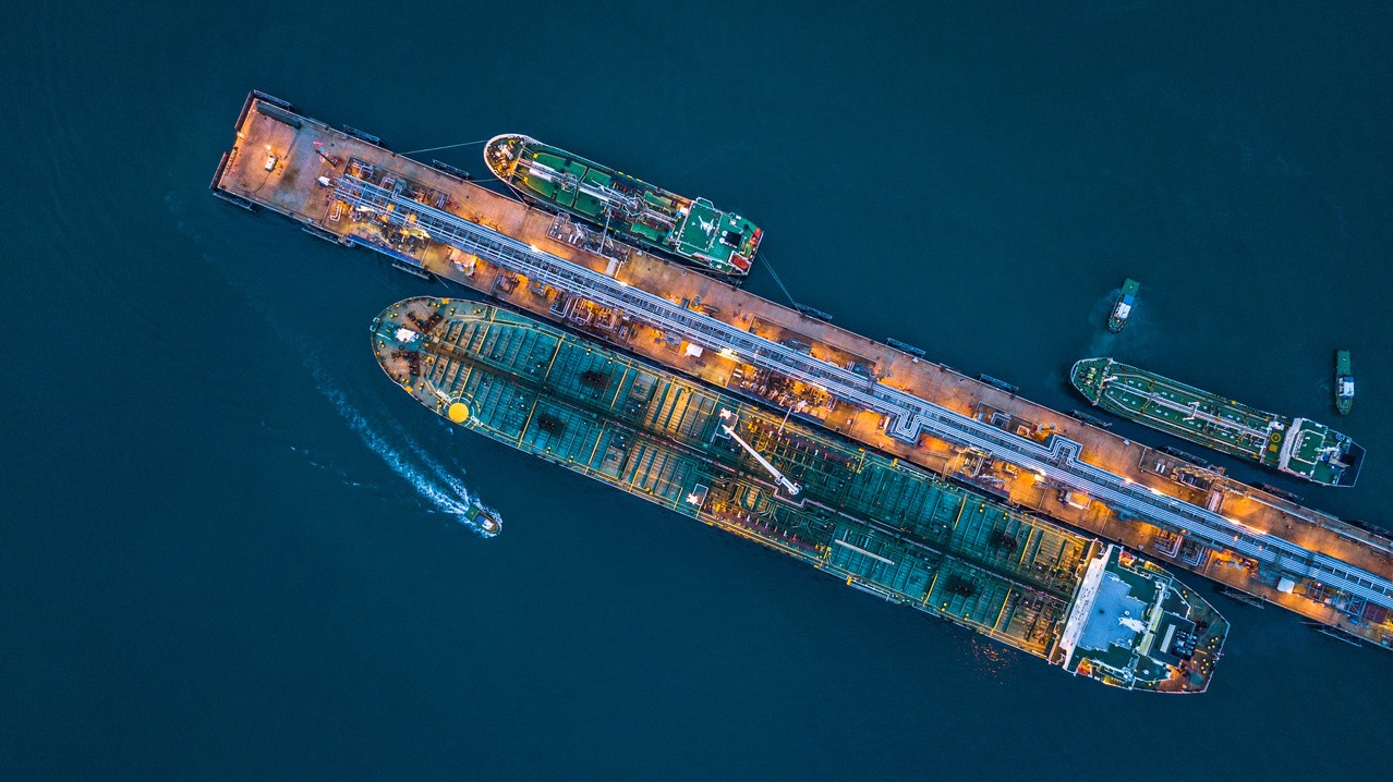 Tanker ship loading and unloading oil and gas storage at industrial port, Business import export petrol chemical oil and gas LNG tanker ship transportation, Loading arm oil and gas offshore platform. ; Shutterstock ID 1165462156; purchase_order:Biofuels as Marine Fuel Whitepaper; client:Meg Dowling